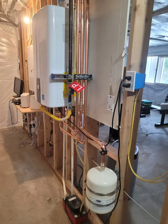 Licensed plumber repairing a kitchen sink in Suffolk